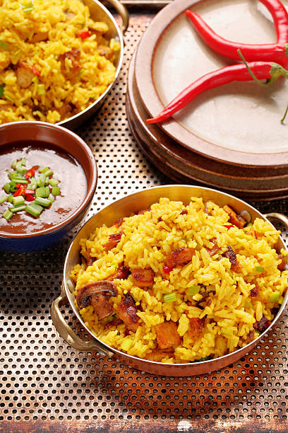 istock Chicken with basmati rice fried in stainless pan 630049050
