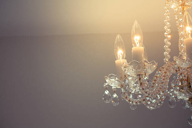 istock Crystal glass glittering chandelier,cross processed colors. 630049182