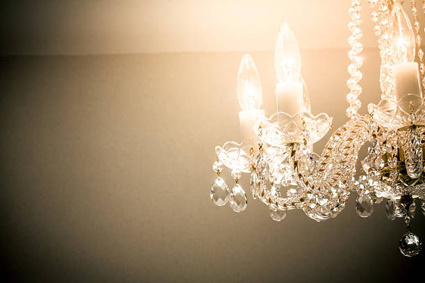 istock Crystal glass glittering chandelier,cross processed colors. 630049250