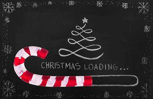 Christmas loading on blackboard. Font used is free for commercial use.