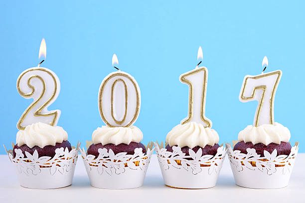 istock Happy New Year cupcakes with 2017 candles 630050774
