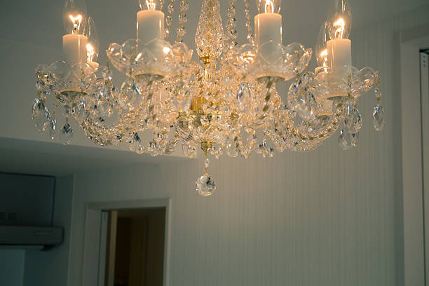istock Crystal glass glittering chandelier,cross processed colors. 630051274