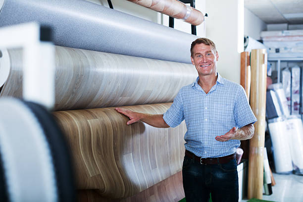 istock male customer choosing linoleum flooring 630052124