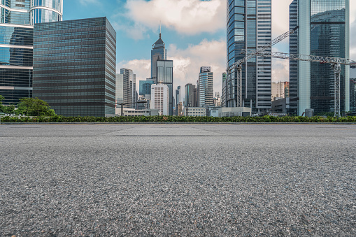 empty asphalt road with central district of Hong Kong on background,China.