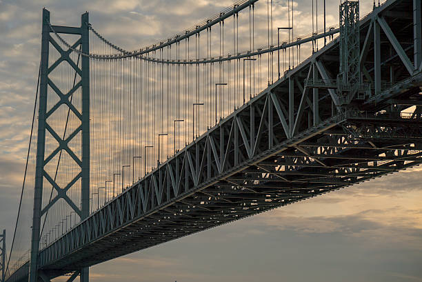 istock Akashi Kaikyo bridge on Sunset twilight sky at Kobe port. 630067568