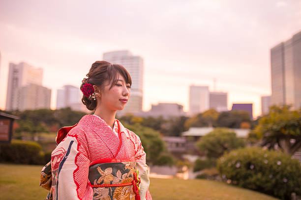 istock Young Furisode girl meditating in the evening 630069202