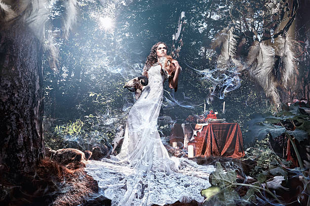 istock Man and woman in a mystical forest. 630069300