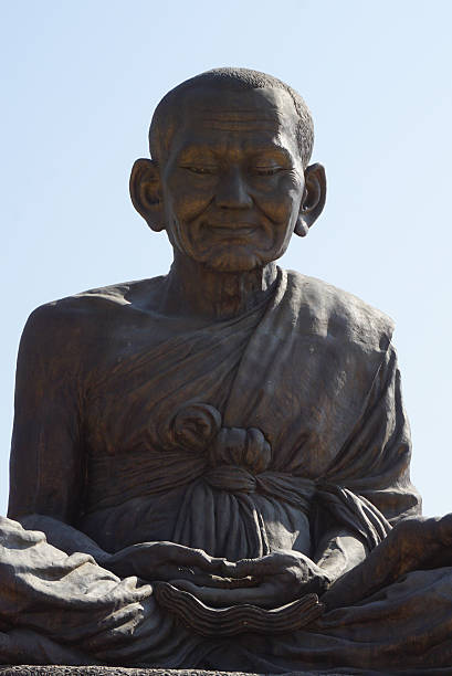 istock Phra Buddhacharn Toh Phomarangsi, Buddha monk statue in Thailand 630619930