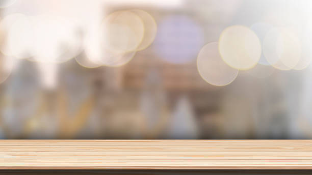 istock Wood table top on bokeh background from decorated Christmas tree 630622278