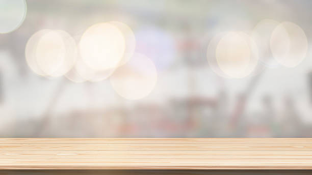 istock Wood table top on bokeh background from decorated Christmas tree 630622484