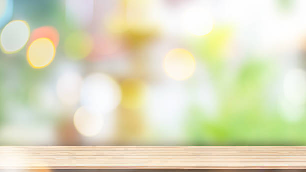 istock Wood table top on blur green background 630623202