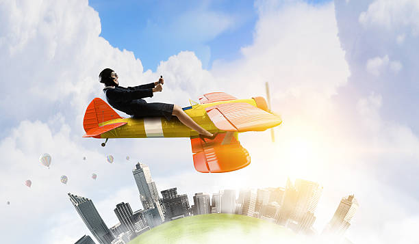 istock Woman in drawn airplane . Mixed media 630624316