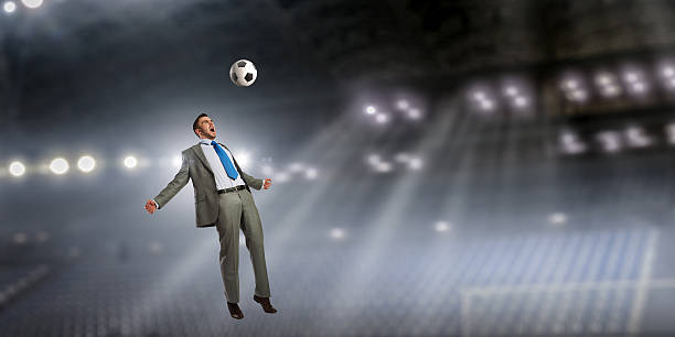 istock Businessman playing soccer . Mixed media 630959882