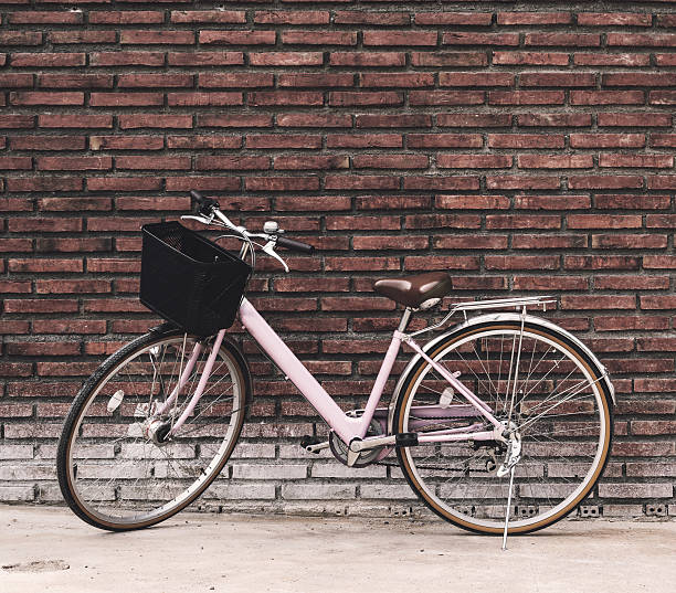 istock Vintage bicycle with old brick wall 631181098
