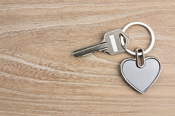istock Heart-shaped keys in the wood 631181162