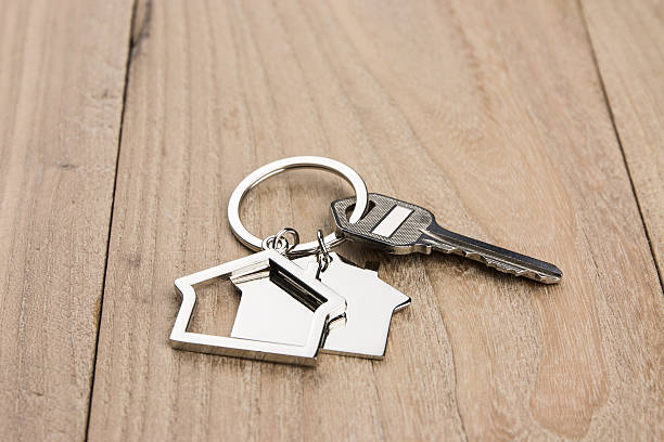 istock House-shaped key in the wood 631182688