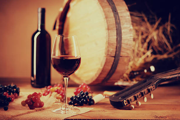 istock Wine bottle, glass, grapes, barrel and guitar 631183534
