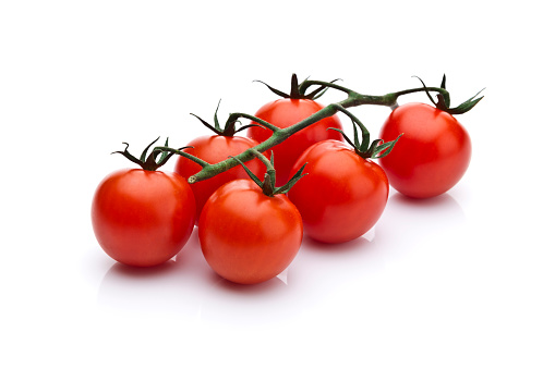 Cherry tomatoes branch isolated on white background.