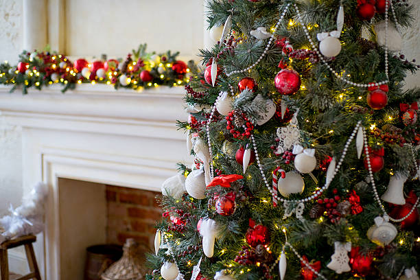 istock Stylish Christmas interior decorated in white and red colors 631184324