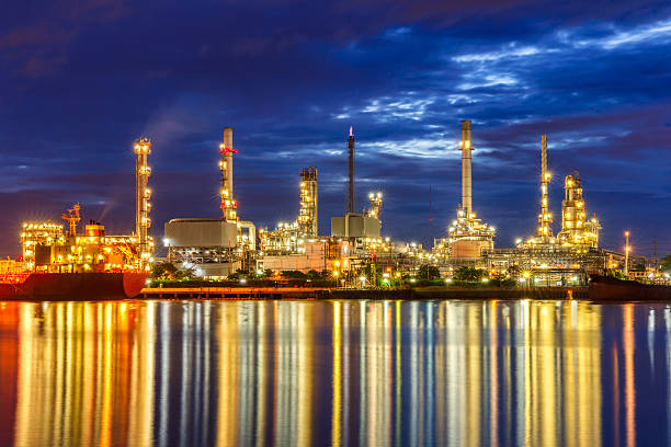 istock Oil refinery along the river at Dusk (Bangkok, Thailand) 631184778