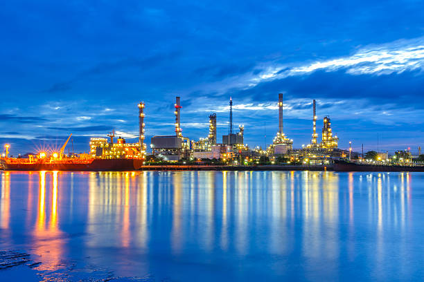 istock Oil refinery along the river at Dusk (Bangkok, Thailand) 631184918