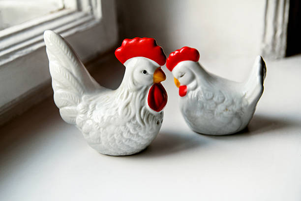 istock Two ceramic figurines of chickens 631185888