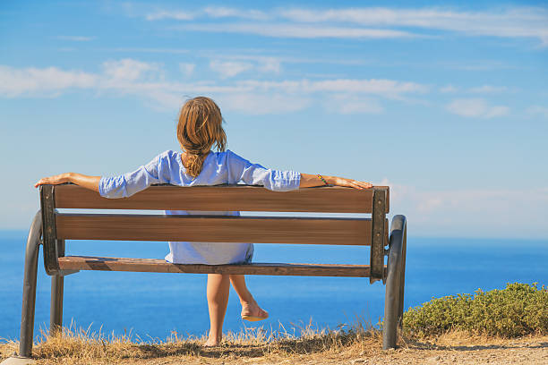 Girl enjoying the ocean / sea view.