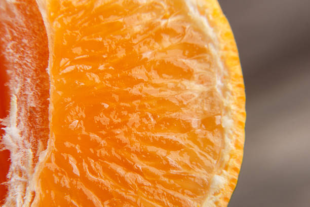 istock Macro texture of sliced mandarin 631186276