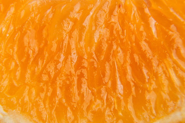 istock Macro texture of sliced mandarin 631186318