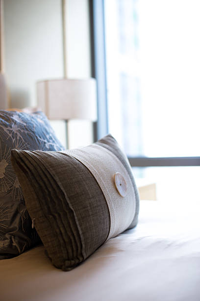 istock pillows on comfortable bed in modern bedroom 631667418