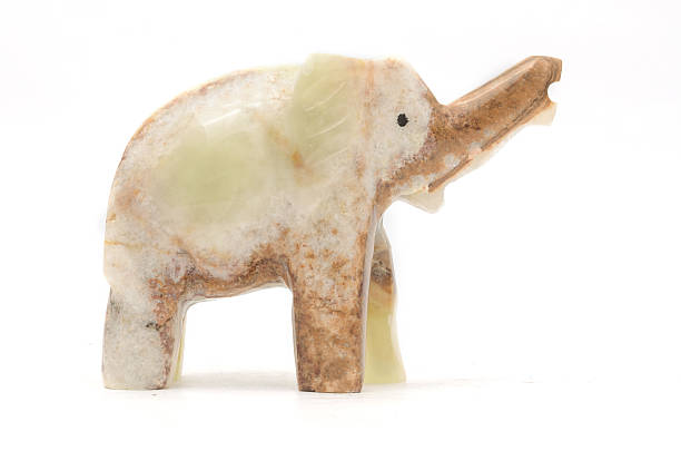 istock elephant figurine made of natural stone isolated on white 631933228