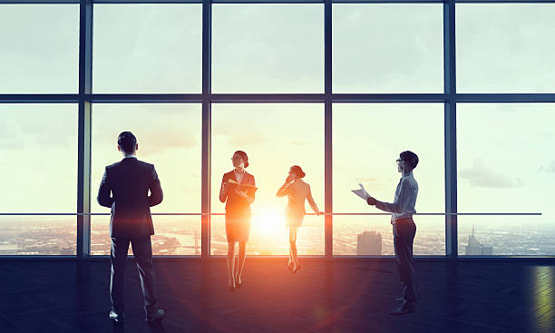 istock Businessteam facing new day . Mixed media 631933422
