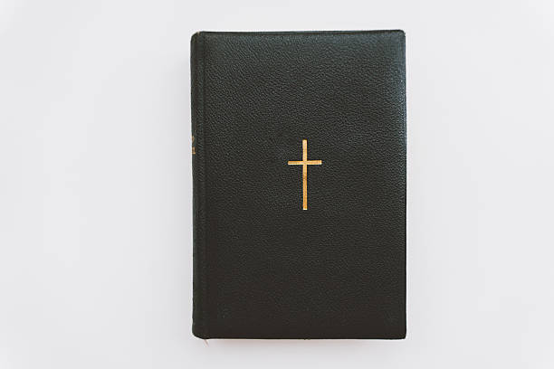 istock Catholic book with a gold cross 631933440