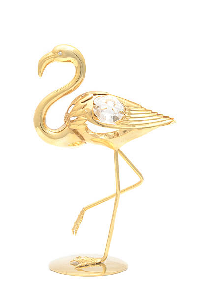figurine golden flamingo isolated on white