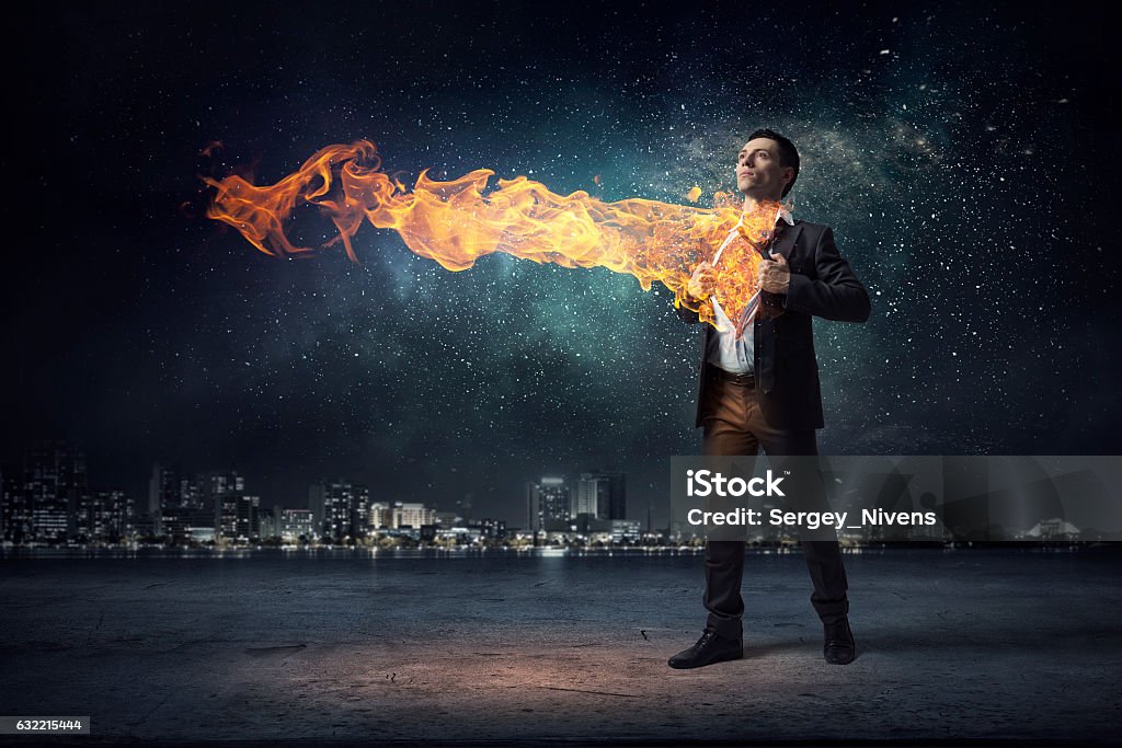 He has super power . Mixed media Businessman in classic pose tearing his shirt on chest Superhero Stock Photo