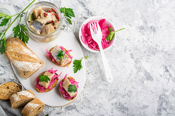Finger snack. Mini open sandwiches with sweet pickled red onion