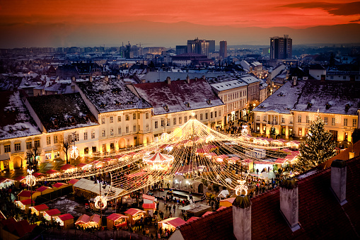 Christmas Market in Sibiu main square, Transylvania Romania. Beautifull sunset in the heart of Transylvania. City also known as Hermannstadt