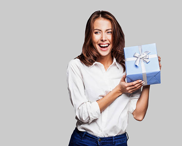 istock Happy woman with a gift 632217686