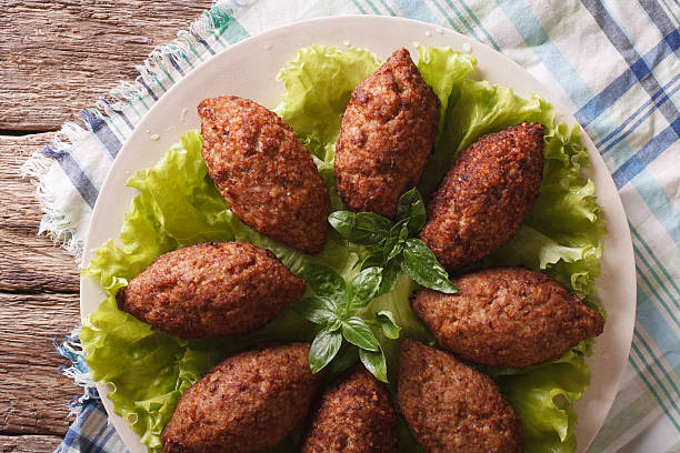 istock Arabic beef meatballs kibbeh close-up on plate. horizontal top view 632219314