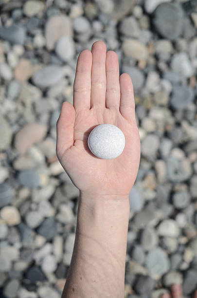 istock Woman hands holding stones. Concept for balance 632439376