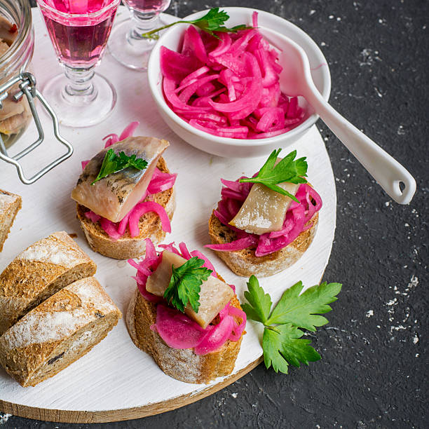istock Small sandwiches for aperitif with marinated sweet onion and salt 632439652