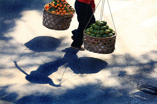 istock Shadow View Of Vietnamese Woman With Carrying 633114886