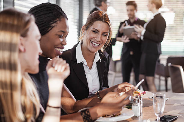 Business People Having a Meal at a Cafe Restaurant Business People at the Cafe Restaurant buffet hotel people women stock pictures, royalty-free photos & images