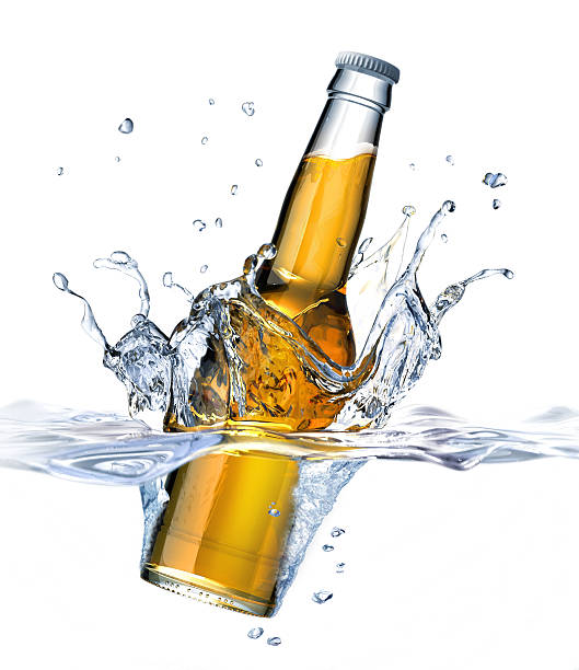 istock Clear Beer bottle falling into water, forming a crown splash 633686080