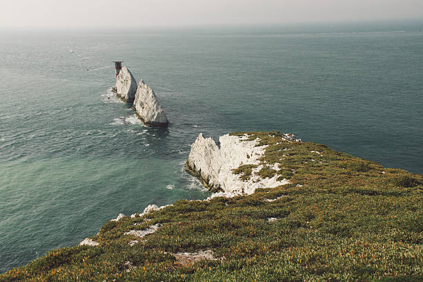 istock Scenic View Of Grassy Cliff By Sea 634512663