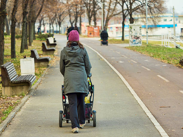 istock Woman with baby in strollers 634573694