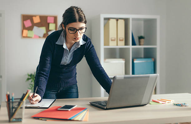 istock Businesswoman Working In Her Office 635475428