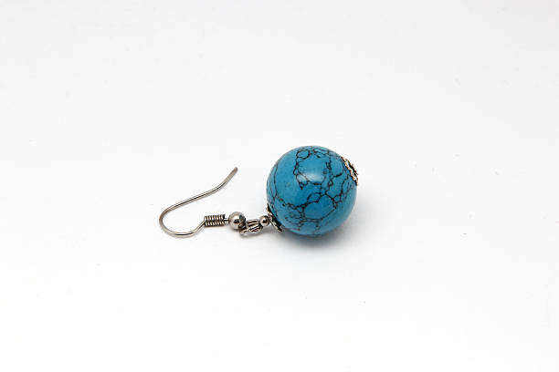 istock Earrings with turquoise on a white background 635476396