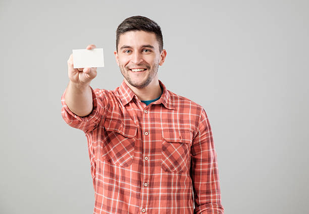 istock Man showing blank business card 635476548