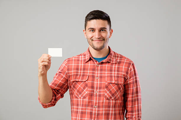 istock Man showing blank business card 635476906